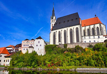 St Vitus church in the historical city centre. View from Vltava River. Cesky Krumlov, Czech Republic.