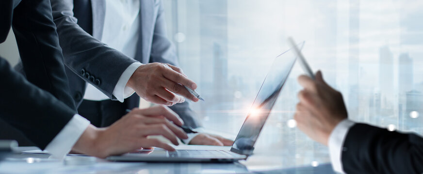 Business professionals brainstorming and data analysis on laptop. Teamwork business decisions and exchanging ideas about strategic plan, Market research on network. - Powered by Adobe