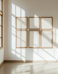 Fototapeta premium Six Empty Light Brown Wooden Frames On A White Wall With Sunlight Shadows