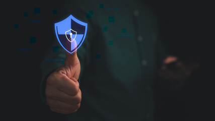 Hand showing thumbs up with digital shield icon, symbolizing cybersecurity, data protection and...