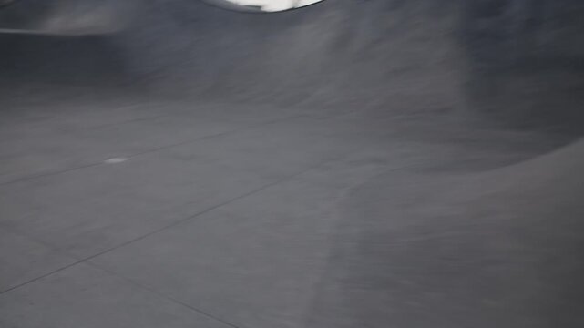 Aggressive inline skating on stone ramps in extreme park POV