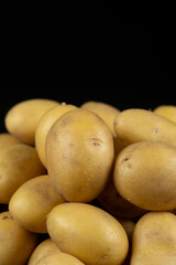 Fresh raw unpeeled potatoes close-up