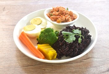 spicy chop chicken chili sauce Thai northern food dipping fresh vegetable topping half cutting boiled egg and rice berry on plate