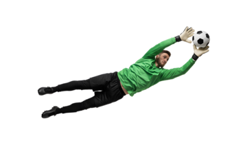 Goalkeeper dives to catch a soccer ball, displaying agility and focus in a dynamic sports action shot, capturing the intensity of a football match