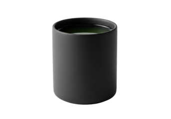 Matte black stoneware tumbler, half-filled with deep moss green herbal infusion, on transparent background with soft studio light, minimalist still life and tranquil reflection.