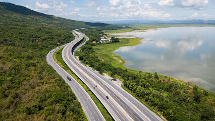 Drone shot The M6 motorway Nakhon Ratchasima Province - Bang Pa-in Lam Ta Khong River and Mountain. Motorway Korat Thailand