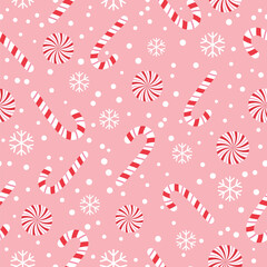 A cheerful seamless pattern with red and white striped candy canes, peppermint candies, and snowflakes on a soft pink background.