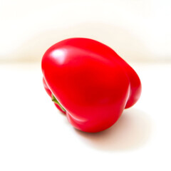A red pepper with a glossy exterior