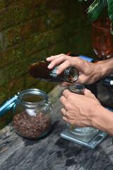 pouring coffee into a glass. manual brew filter coffee
