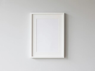 Blank White Vertical Photo Frame Mockup on a Minimalist Gray Wall in a Modern Home or Office Interior