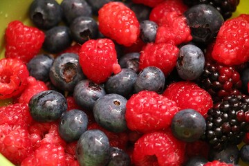close-up of fresh raspberries, blueberries, and blackberries