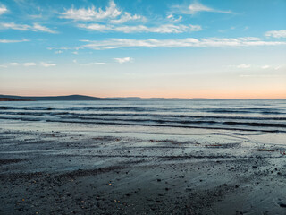 surf waves of clear blue waters of the Arctic Ocean