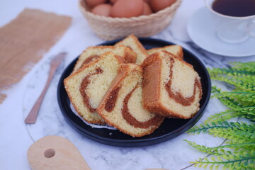 Delicious Sliced Marble Cake with Coffee and Eggs