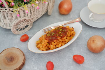 Delicious Macaroni Pasta with Tomato Sauce on a White Plate