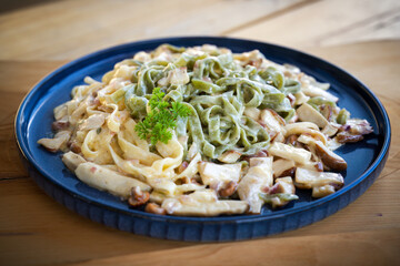 tagliatelle and mushrooms, boletus edulis, in a creamy sauce