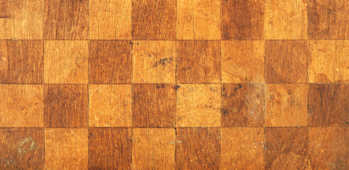 Vintage wooden chessboard with numbered ranks and files on display