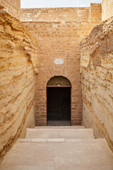 The monumental entrance door of the famous serapeum in Saqqara, Egypt