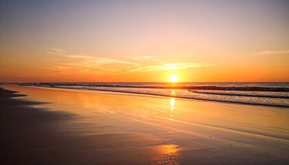 Golden sunset over calm ocean beach with reflection on wet sand and serene waves