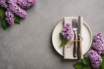 Springtime table decor adorned with lovely lilac flowers set against a grey concrete backdrop and room for customization