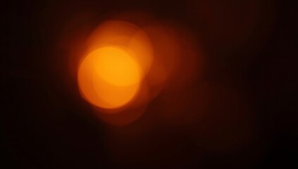 grainy colorful warm orange light leaks on black background with dust texture. abstract damaged scratched retro film analog effect for using over photos as overlay or screen filter