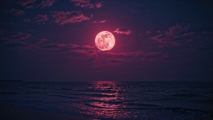 Softly tinted pink moon casting light in a shadowy sky with faint clouds over the ocean, providing blank space for text