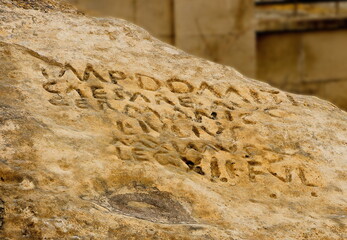 Ancient inscription left by the Roman legion on a stone in Gobustan. Republic of Azerbaijan