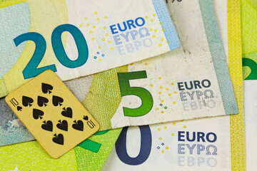 The currency issued by the European Union and a playing card