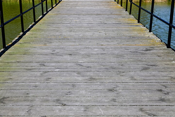 Obraz premium The flooring of the pier on Jamno Lake in the resort town of Mielno, Poland