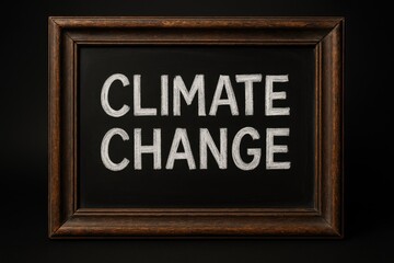 Black chalkboard with climate change message in white chalk