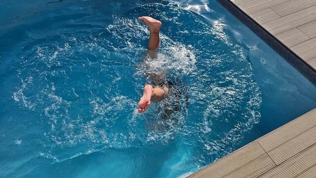Wide View of Man Swimming in Private Backyard Pool – Active Lifestyle