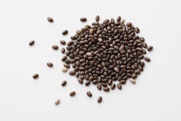 Close-up of a handful of chia seeds dispersed unevenly against a white background