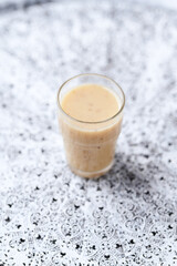 Pineapple coconut smoothie on bright background. Soft focus. Copy space.	