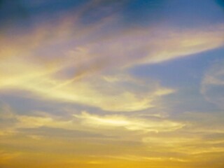 The colors of the morning blend in a harmony of gold and blue.