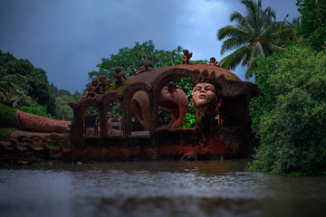 Traditional mud Sculpture by the Riverside in Goa, India