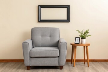 Gray armchair with wooden side table and plant on beige wall