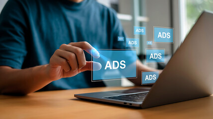 Person interacting with digital advertising interface on a tablet displaying the word ads
