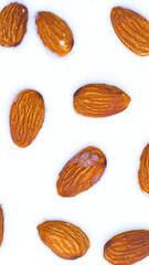 Almonds floating in milk – plant-based nutrition and vegan almond milk concept