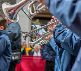 VIEW OF TRUMPETS FROM A BAND AT A STREET PARTY