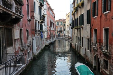 Morning view of the old town, canal and old bridge in the San Marco district of Venice, Italy