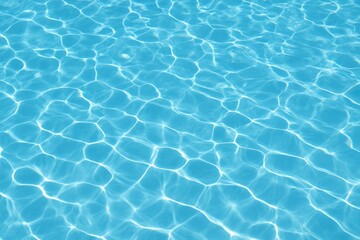 Elegant wave patterns on a clear blue pool water surface