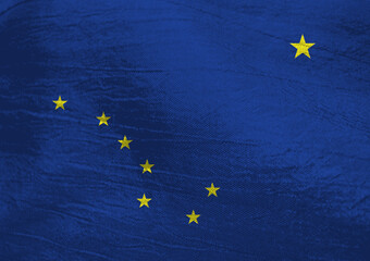 Colors of Alaska's flag waving gently in the breeze at sunset