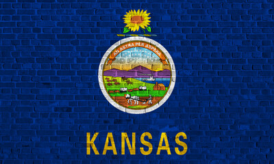 Exploring the vibrant mural of Kansas state emblem on a brick wall