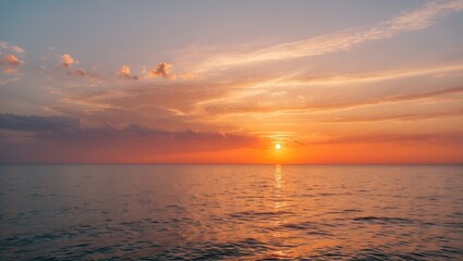 Obraz premium Sunset with orange hues casting a haze on the waters
