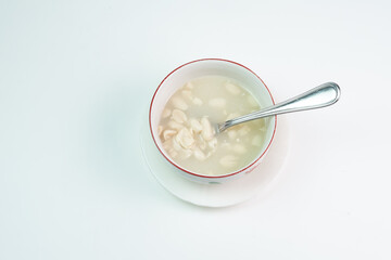 a bowl of huāshēng tángshuǐ or Wedang Kacang, a popular dessert in Southeast Asia with Chinese-Peranakan influences. The warm sweet soup, with a base of blanched