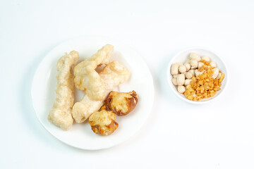 Cuankie is a popular Indonesian street food from Bandung, West Java. type of bakso (meatball soup) distinguished by its pre-fried, dry components like fish balls and tofu, served by adding hot  water