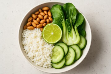 Fresh vegetable and rice bowl with lime and bok choy from a top perspective