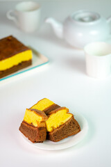 slices of Lapis Surabaya, a famous Indonesian layer cake. A simple, minimalist food shot with ample copy space for text or other graphic elements.