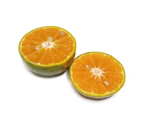 Fresh orange fruit cut in half, isolated on white background. Citrus photography, healthy tropical fruit, vitamin C, natural food, diet and nutrition concept.