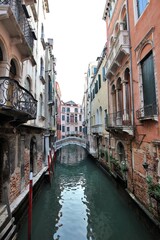 Morning view of the old town, canal and old bridge in the San Marco district of Venice, Italy