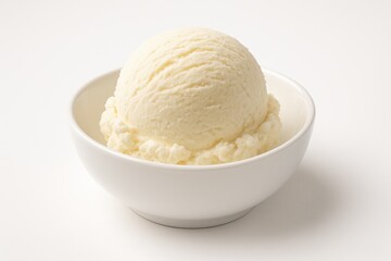 Single ice cream ball served in a white dish against a white backdrop